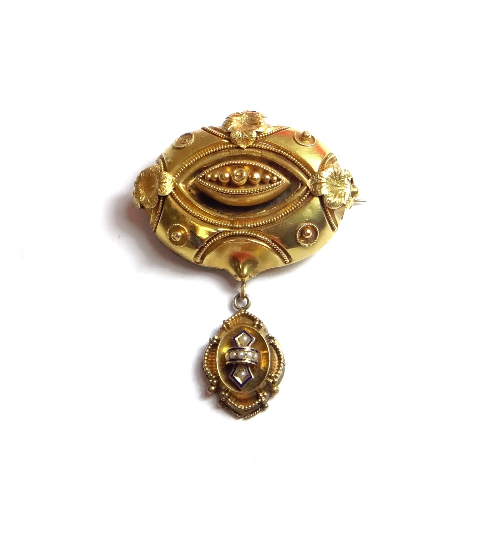 Appraisal: A Victorian gold oval brooch decorated with foliate motifs and