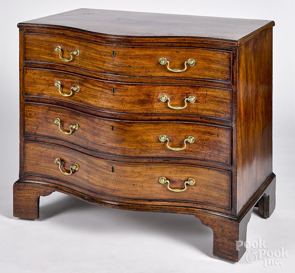 Appraisal: George III mahogany serpentine chest of drawers George III mahogany