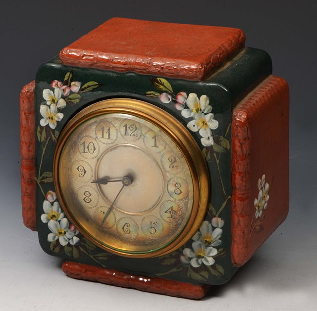 Appraisal: A WATCOMBE TERRACOTTA SQUARE SHAPED MANTEL CLOCK with silvered dial