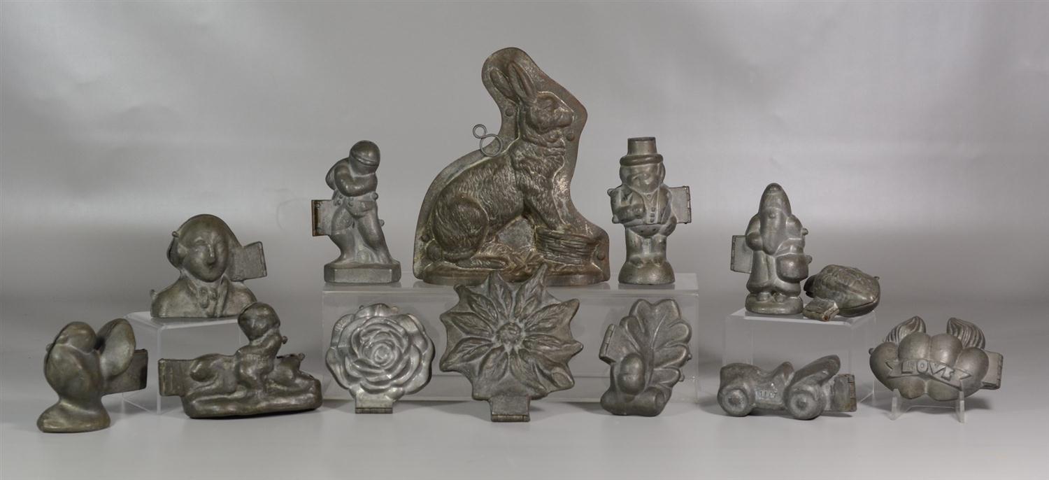 Appraisal: Figural molds including pewter ice cream molds ball player George