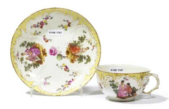 Appraisal: CUP AND SAUCER WITH WATTEAU SCENES Berlin KPM circa 'Reliefzierrat