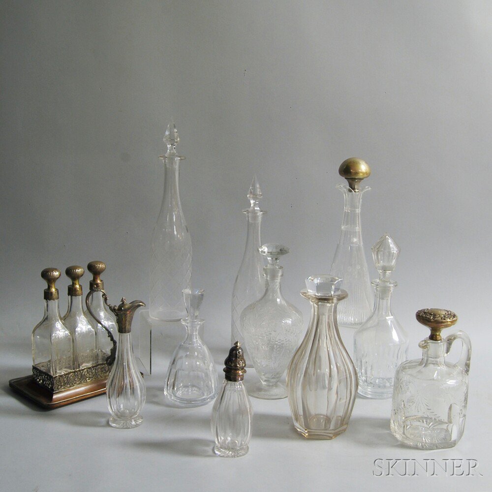 Appraisal: Thirteen Colorless Glass Cruets and Decanters including a French sterling