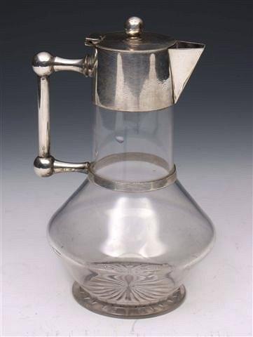 Appraisal: A CUT GLASS AND SILVER PLATED CLARET JUG after a