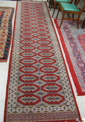 Appraisal: TWO RED FIELD BOKHARA AREA RUGS ' X ' and