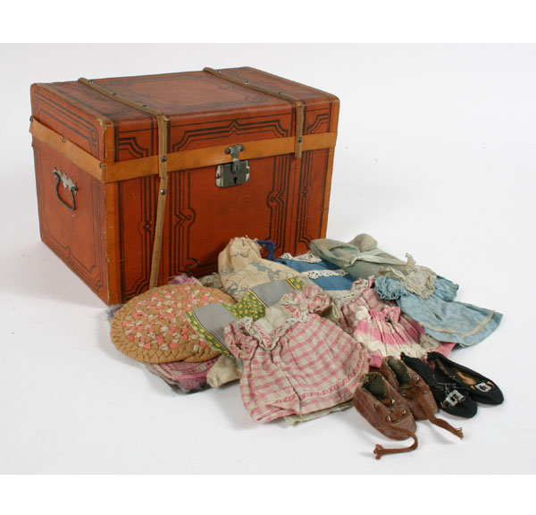 Appraisal: Stenciled doll steamer trunk filled with doll clothes miniature rugs