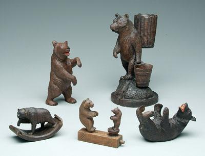 Appraisal: Five carved bear figures standing with grape baskets in pest