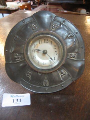 Appraisal: A LIBERTY PEWTER TRAVELLING CLOCK of circular form in the