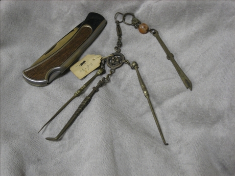 Appraisal: SILVER TIBETAN TYPE CHATELAINE AND KEY With agate and unusual