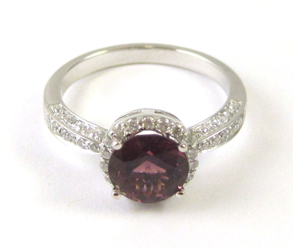 Appraisal: GARNET DIAMOND AND FOURTEEN KARAT GOLD RING The white gold