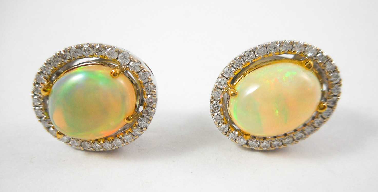 Appraisal: PAIR OF JELLY OPAL AND DIAMOND STUD EARRINGS each k