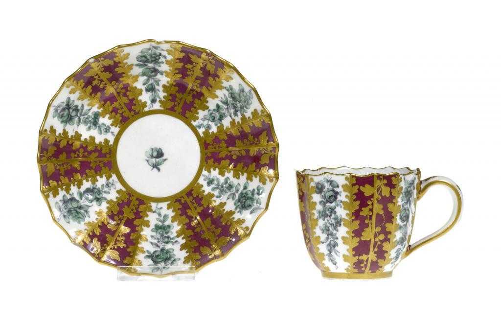 Appraisal: A CHELSEA-DERBY FLUTED COFFEE CUP AND SAUCER painted in green