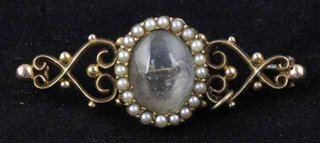 Appraisal: A Victorian moonstone brooch the oval stone with a border