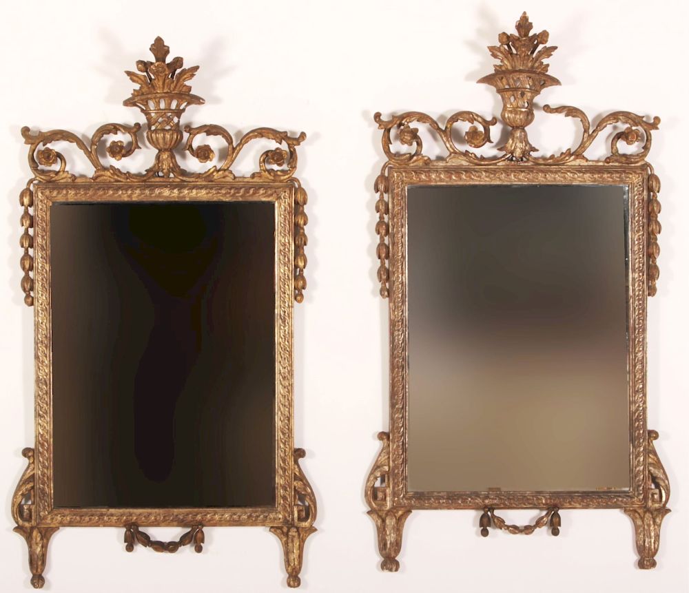 Appraisal: Near Pair English Rococo Mirrors Similar decorative but carving style