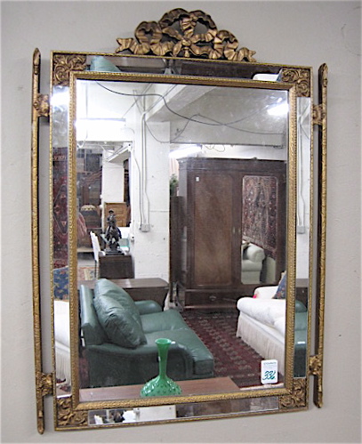 Appraisal: AN AMERICAN RECTANGULAR WALL MIRROR The gilt wood frame having