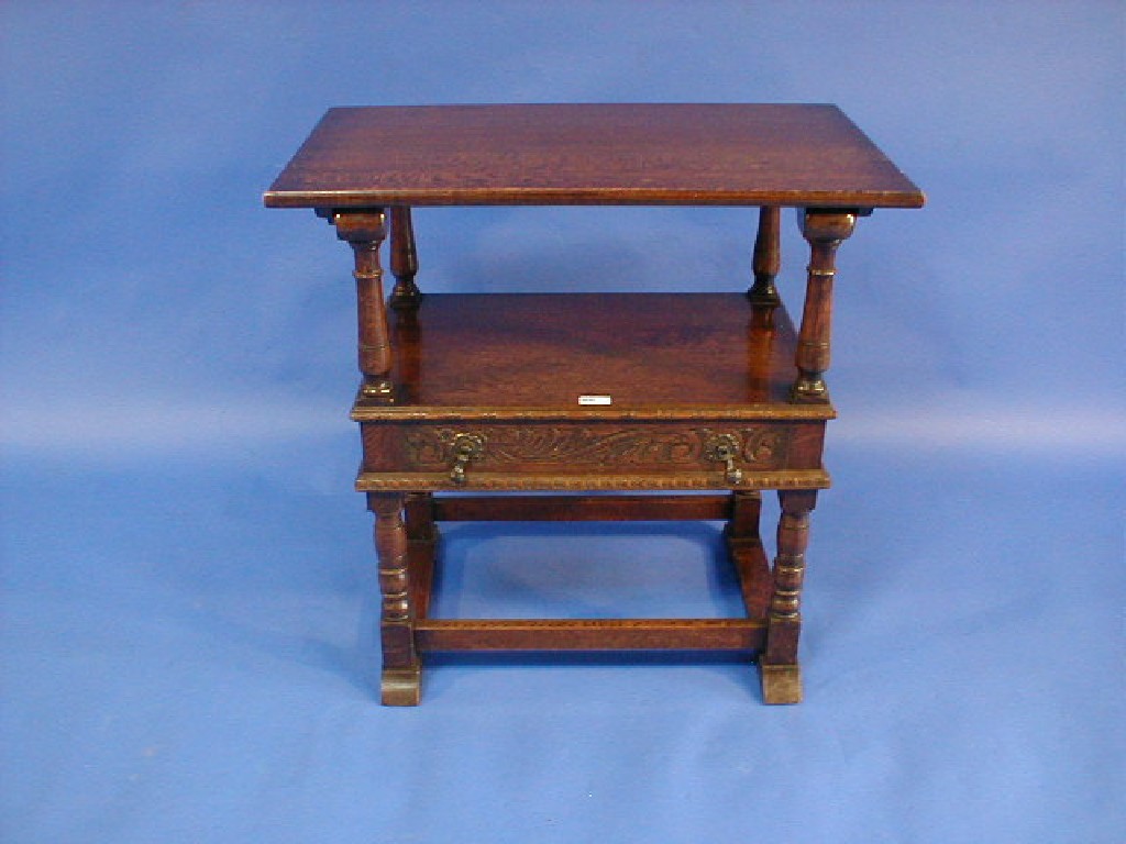 Appraisal: An oak monks bench of small proportions of drawer and