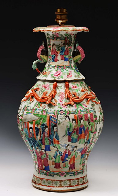 Appraisal: A CHINESE CANTON BALUSTER VASE with crane handles raised dragons