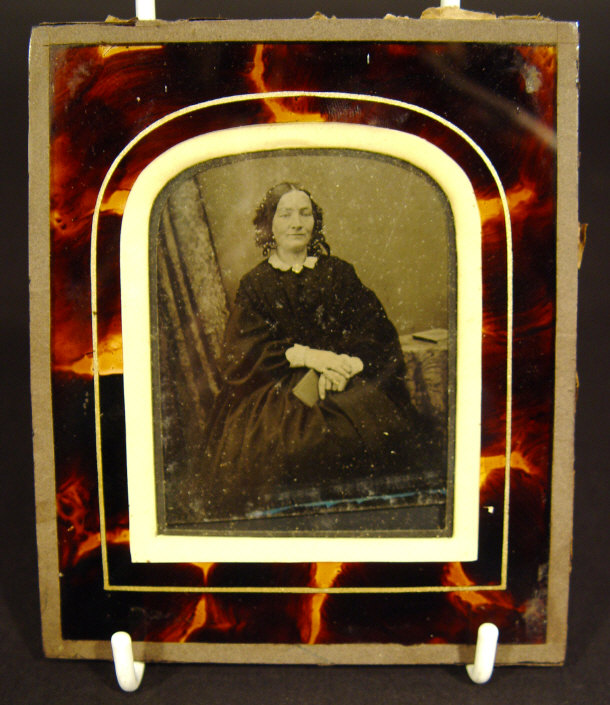 Appraisal: Victorian photographic portrait of a young woman in a simulated