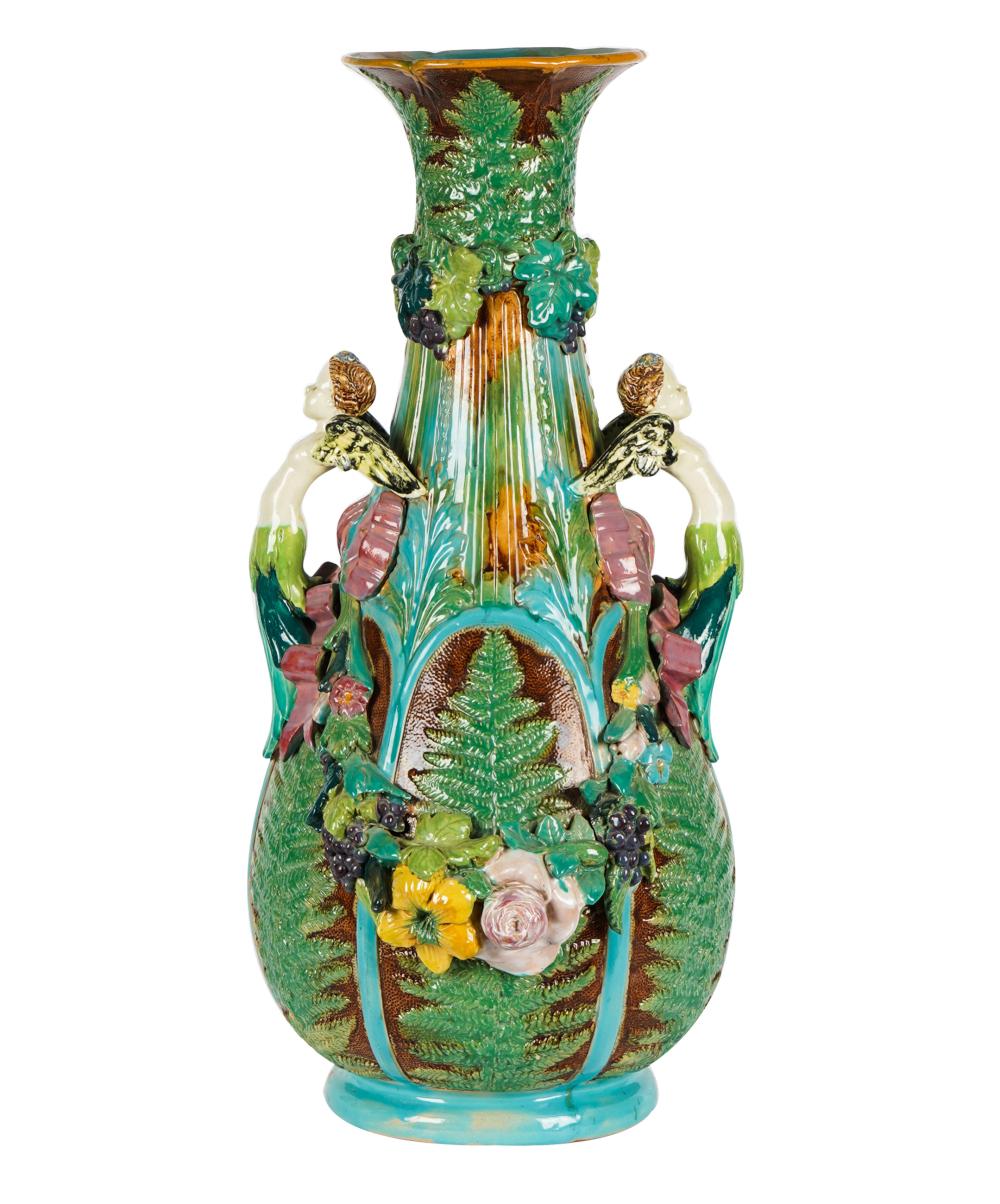 Appraisal: MAJOLICA URNunmarked with figural handles inches wide inches deep inches