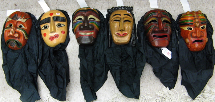 Appraisal: GROUP OF SIX CARVED WOOD AND PAINTED FACE MASKS Mother