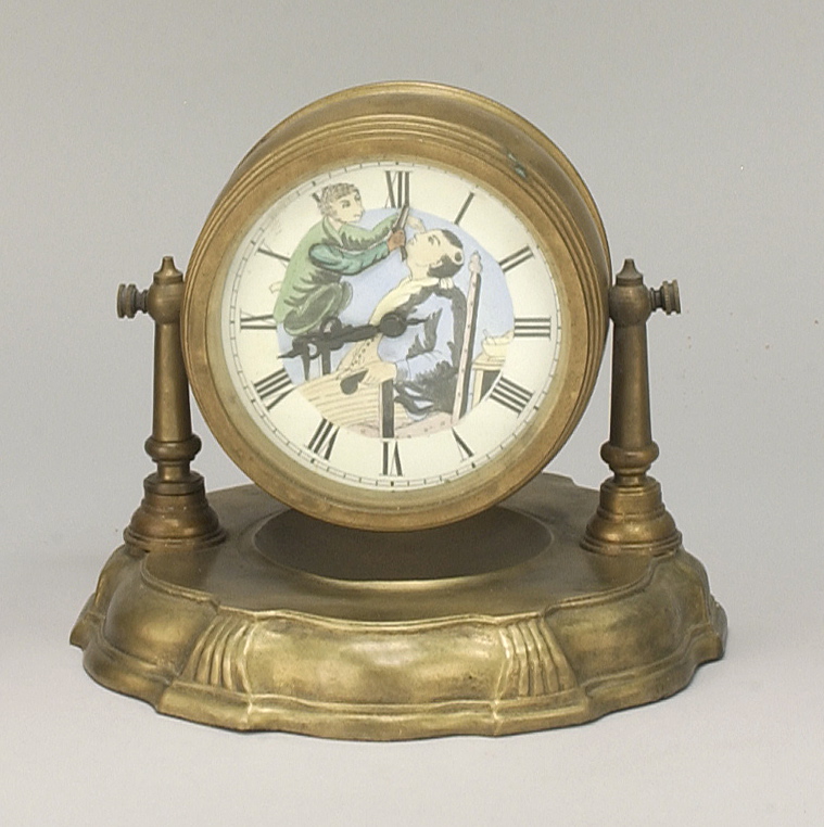 Appraisal: NOVELTY CLOCK Dial decorated with a monkey shaving a man