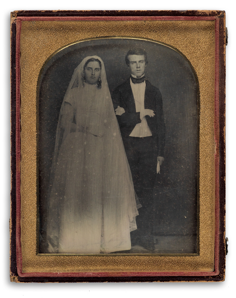 Appraisal: COMMEMORATIVE Half-plate daguerreotype wedding portrait of a young couple with