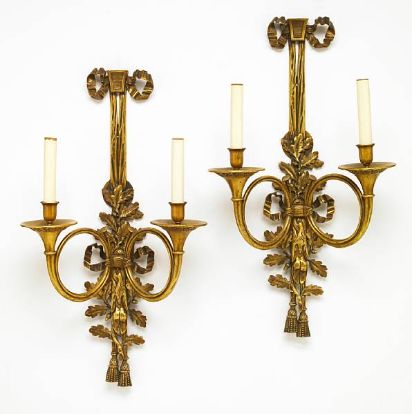 Appraisal: A pair of Louis XVI style gilt bronze two light