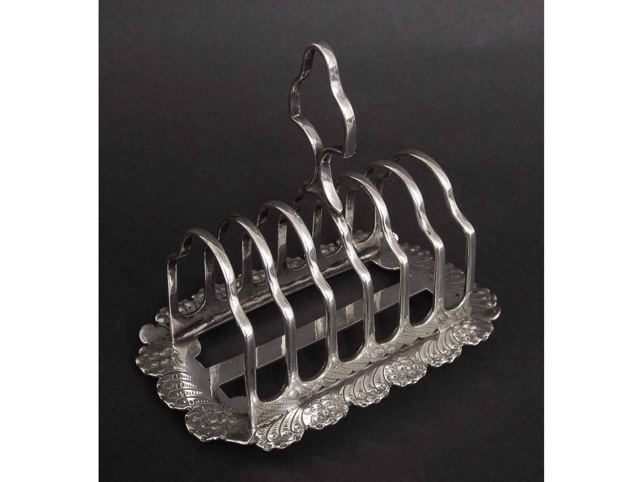 Appraisal: Attractive late Victorian silver toast rack the six division rack