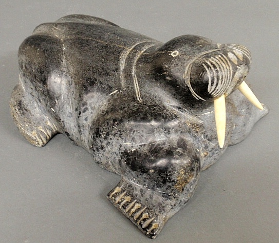 Appraisal: - Large Inuit carved stone walrus with ivory tusks h