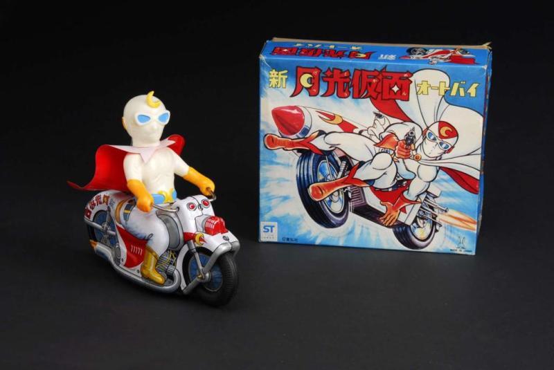 Appraisal: Moonlite Man Riding Motorcycle Toy Description Japanese Working When in