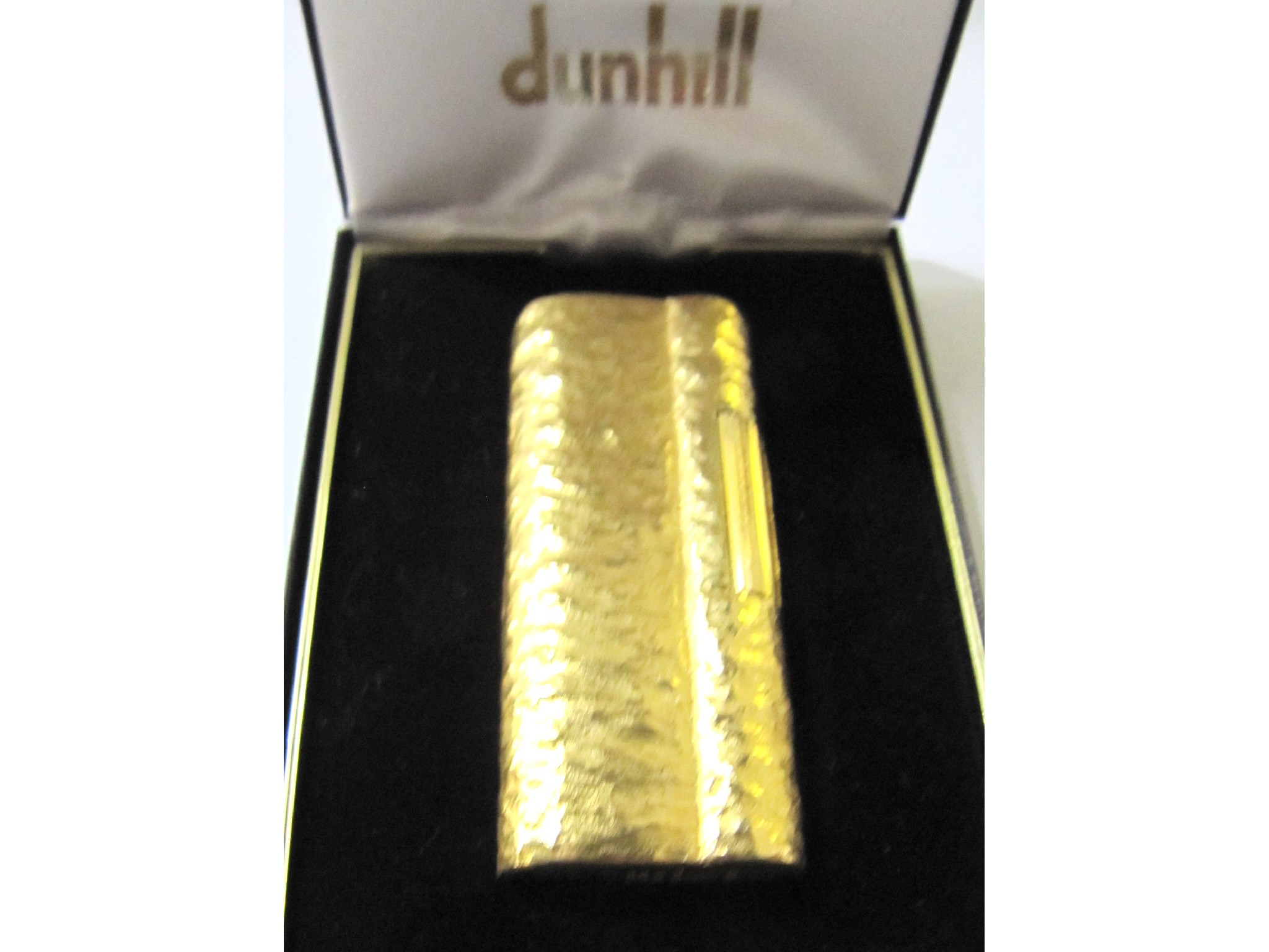 Appraisal: A bark effect Dunhill cigarette lighter in original box with