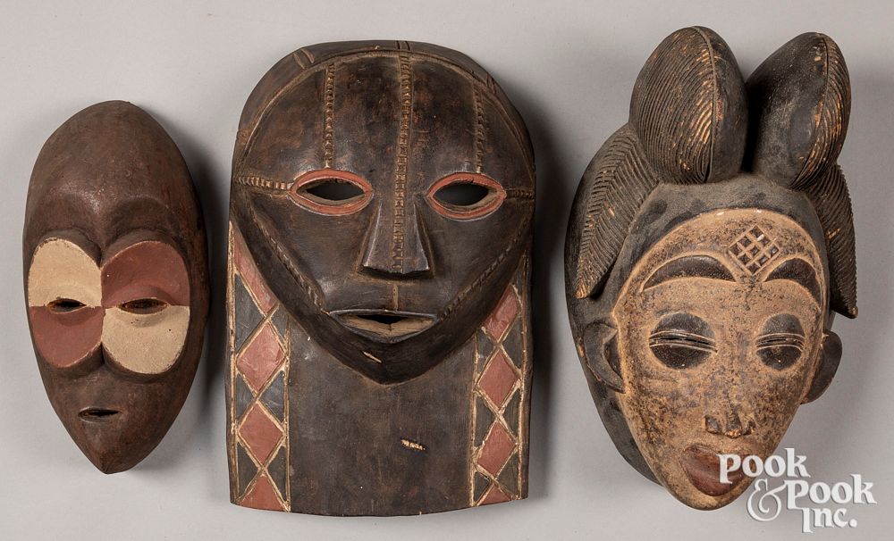 Appraisal: Three African carved and painted masks Three African carved and