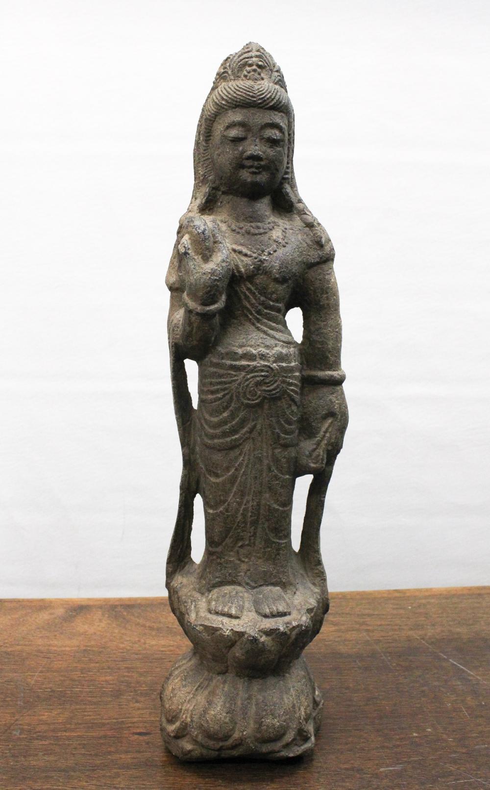 Appraisal: CHINESE CARVED STONE GUANYIN SCULPTURE the standing figure raised on