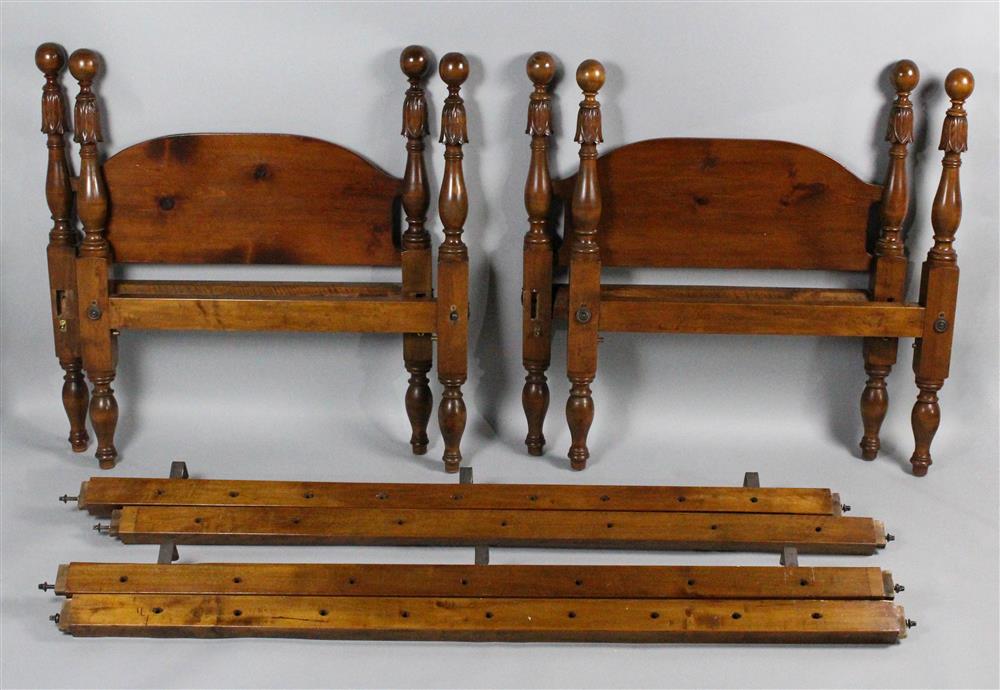 Appraisal: PAIR OF TWIN CANNONBALL CARVED MIXED WOOD BED FRAMES each