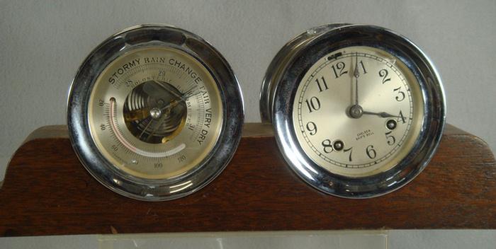 Appraisal: Chelsea ships clock and barometer set mahogany stand dials chrome