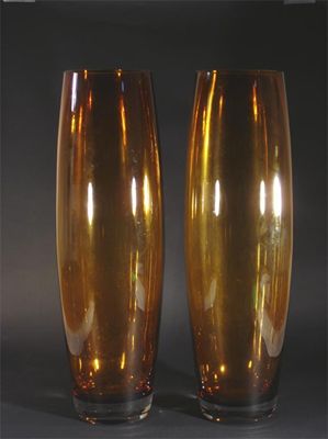 Appraisal: A tall pair of amber glass vases slightly swollen form