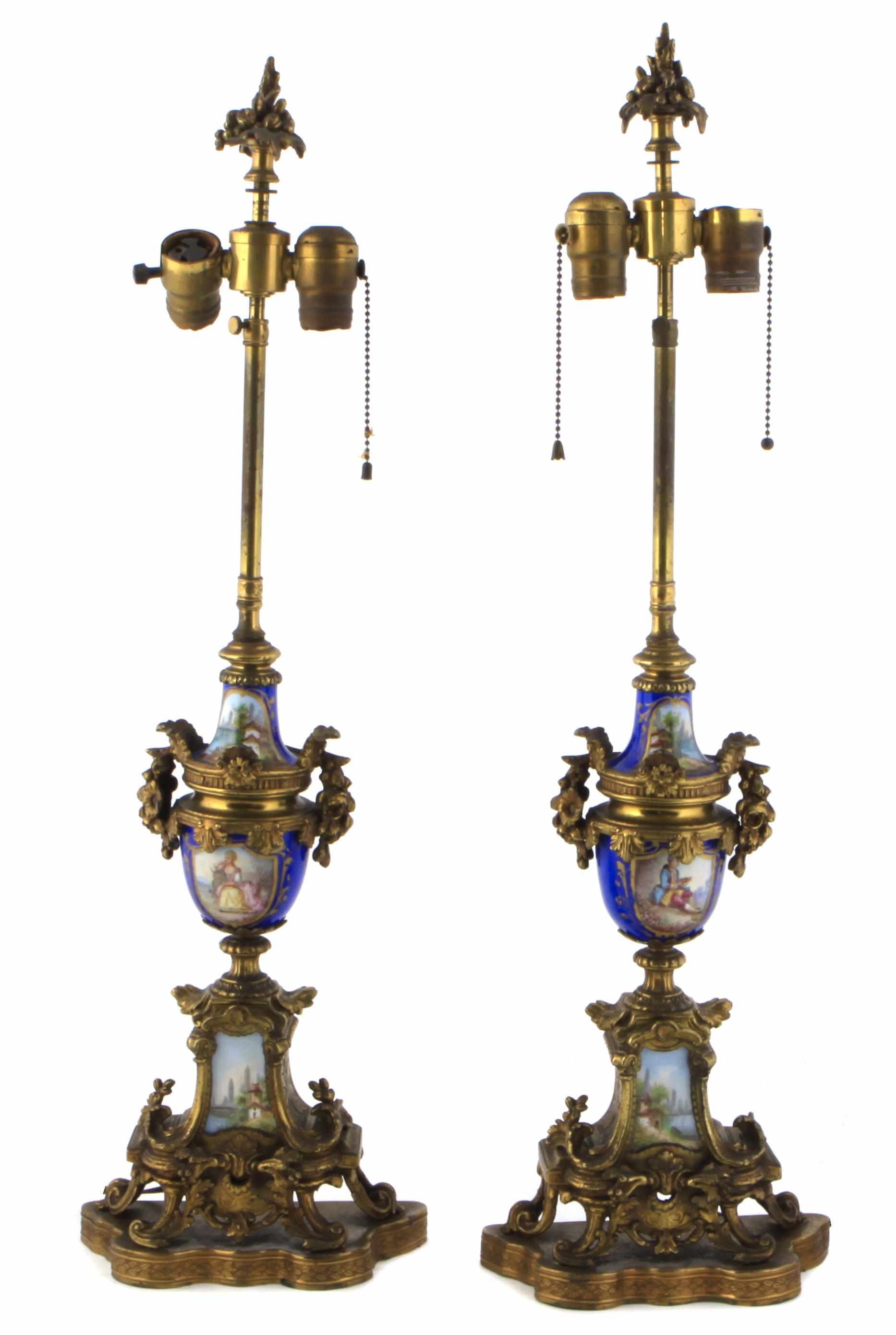 Appraisal: A pair of gilt metal and porcelain urns now mounted