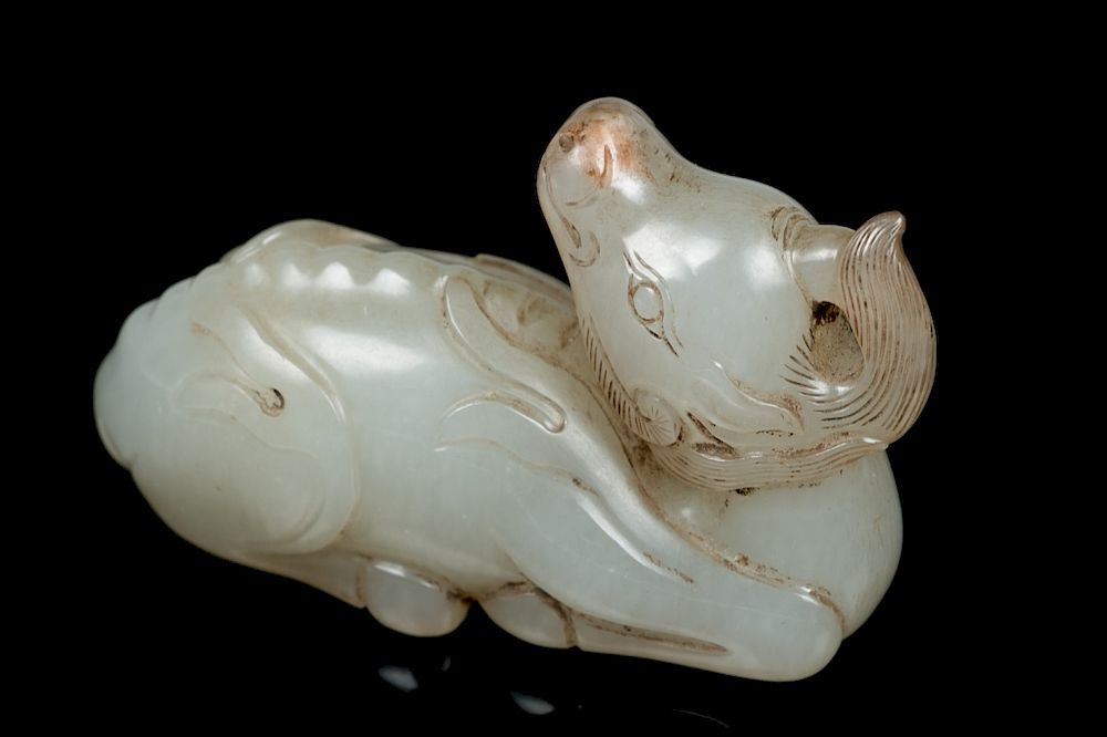 Appraisal: JADE BEAST CARVING Depicting a recumbent beast finely carved in