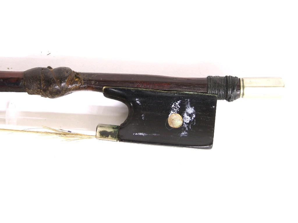 Appraisal: Nickel mounted violin bow stamped Peccatte the stick round the