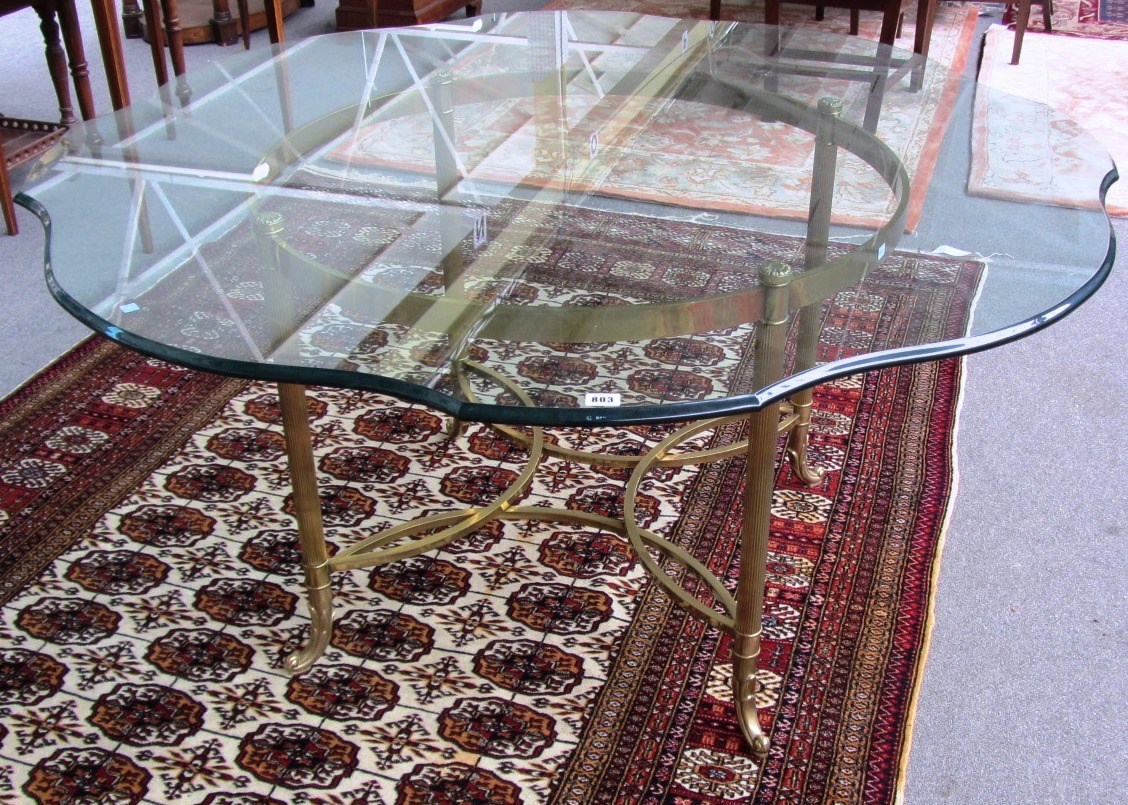 Appraisal: A th century dining table the shaped circular glass top