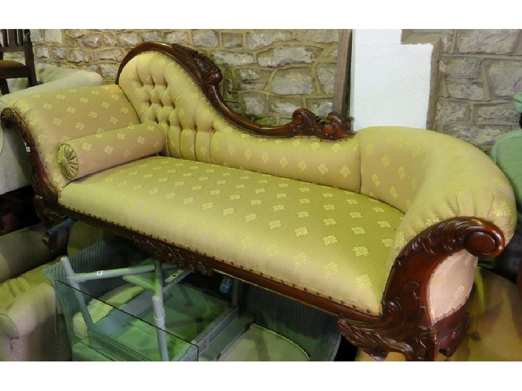 Appraisal: A reproduction sofa chaise lounge with floral upholstered seat button