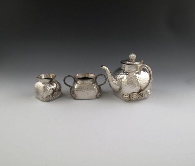 Appraisal: A three-piece Chinese silver tea set possibly by Tu Mao