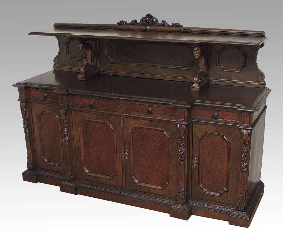 Appraisal: FRENCH WALNUT CARVED SIDEBOARD Carved crest over top shelf supported