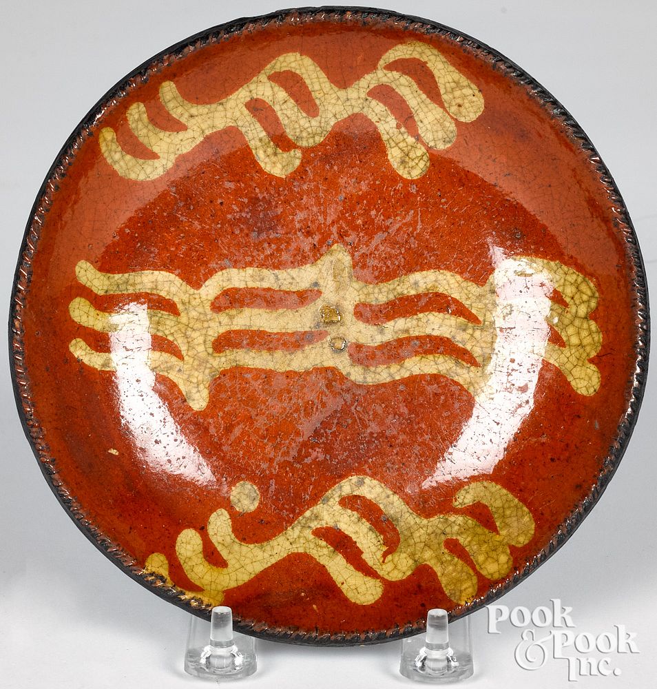 Appraisal: Pennsylvania redware plate th c Pennsylvania redware plate th c