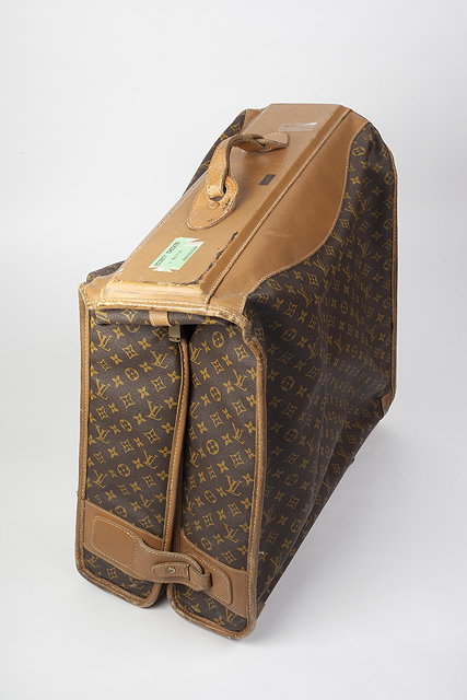 Appraisal: A portable leather monogram garment carrier by Louis Vuitton of