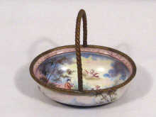 Appraisal: A Viennese enamel miniature swing handled basket circa