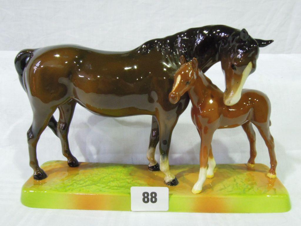 Appraisal: A Beswick model of a horse and foal mounted on