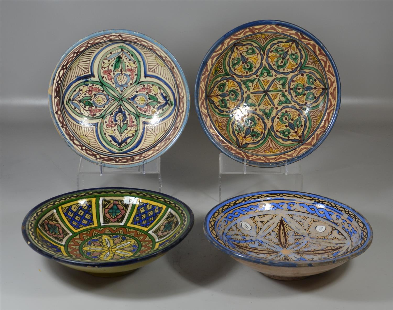 Appraisal: Moroccan faience earthenware bowls geometric and foliate motifs th th