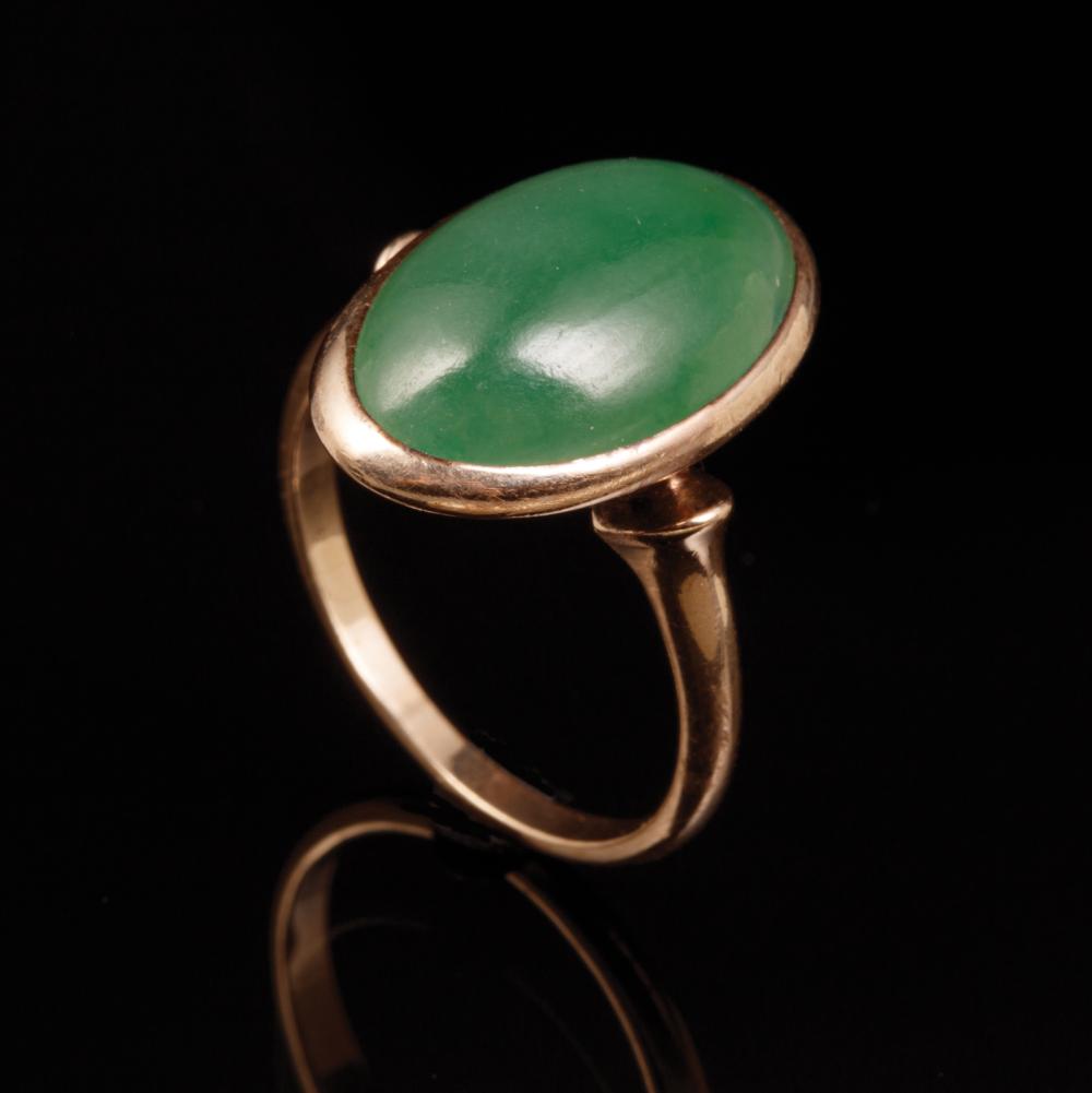 Appraisal: kt Yellow Gold and Jadeite Ring center oval cabochon emerald