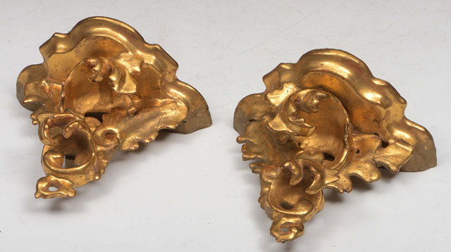 Appraisal: A PAIR OF FLORENTINE STYLE CARVED GILTWOOD WALL BRACKETS of