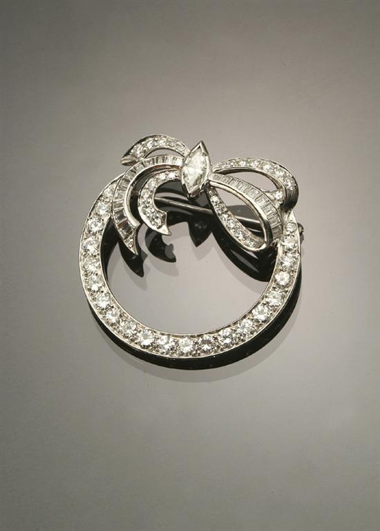 Appraisal: Platinum and Diamond Circle Bowknot Brooch Set with one marquise